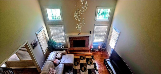 living area with a high ceiling and a healthy amount of sunlight