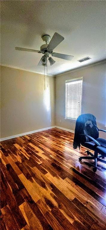 spare room with baseboards, visible vents, hardwood / wood-style flooring, and ceiling fan