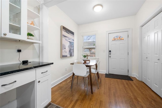 dining room with wood-type flooring