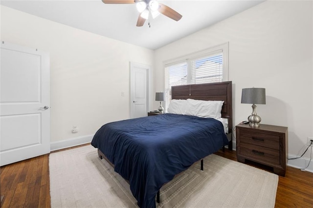 bedroom with hardwood / wood-style flooring and ceiling fan