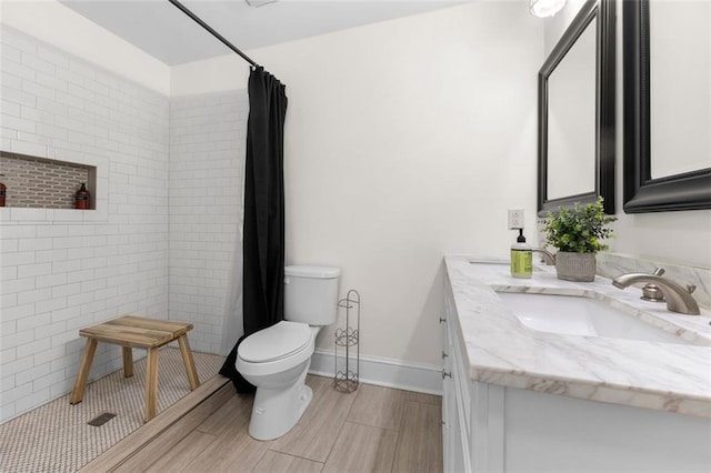 bathroom with vanity, a shower with curtain, and toilet