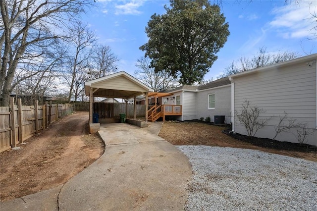 exterior space featuring a carport and central AC unit