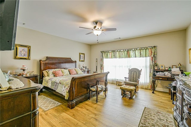 bedroom with light wood-type flooring and ceiling fan