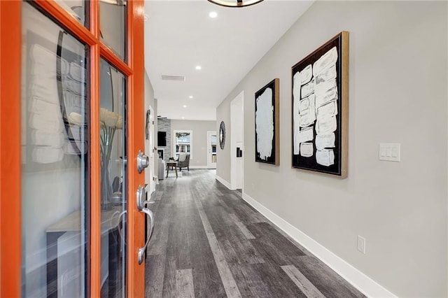 hall with dark hardwood / wood-style flooring and french doors