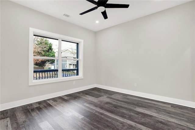 empty room featuring dark hardwood / wood-style floors and ceiling fan