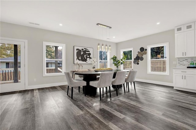 dining area featuring dark hardwood / wood-style flooring