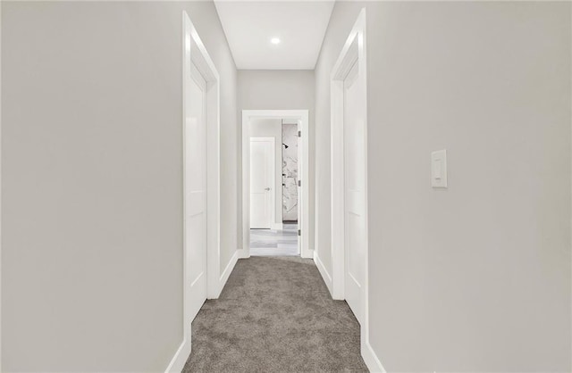 corridor with light colored carpet