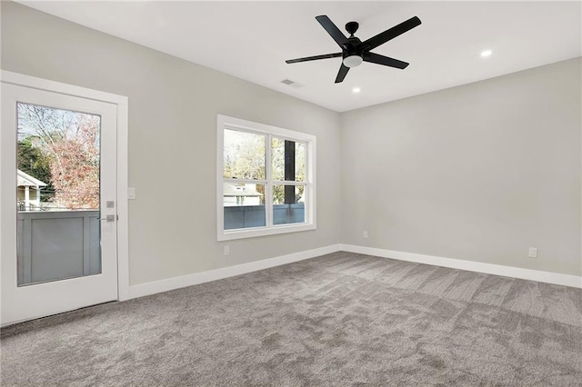 carpeted empty room with ceiling fan