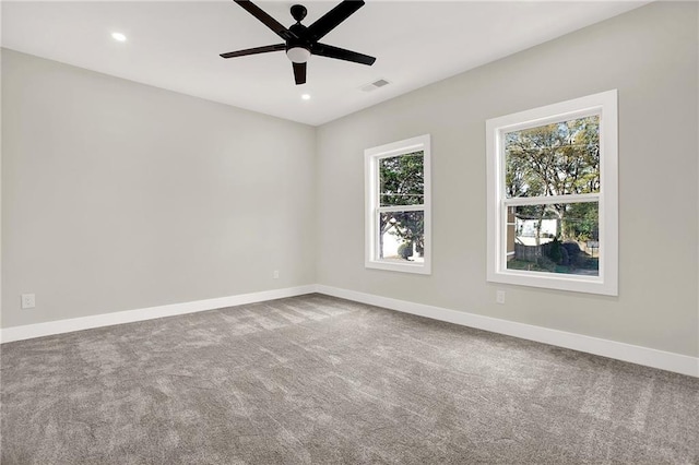 empty room featuring carpet flooring and ceiling fan