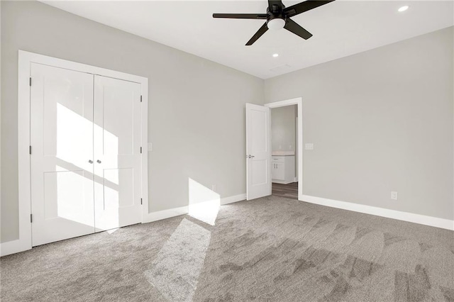 unfurnished bedroom featuring carpet, ceiling fan, and a closet