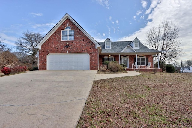 view of front of property featuring a garage and covered porch