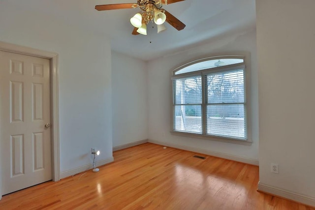 unfurnished room with ceiling fan and light hardwood / wood-style flooring