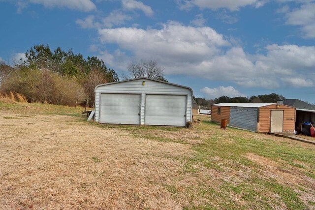 garage with a lawn