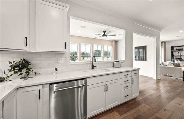 kitchen featuring sink, white cabinetry, dishwasher, backsplash, and dark wood-type flooring