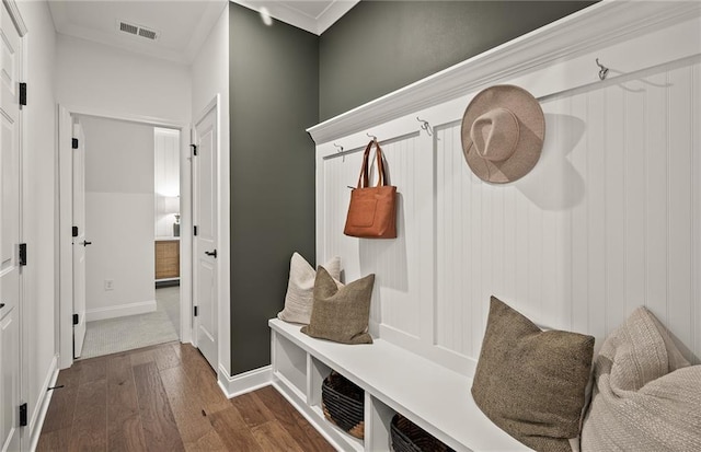 mudroom with crown molding and dark hardwood / wood-style floors