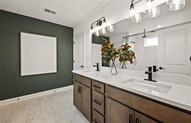 bathroom featuring walk in shower and vanity