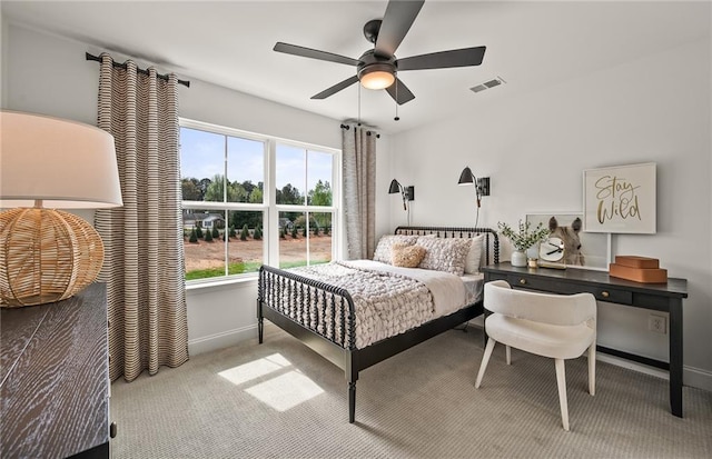 bedroom with ceiling fan and light colored carpet