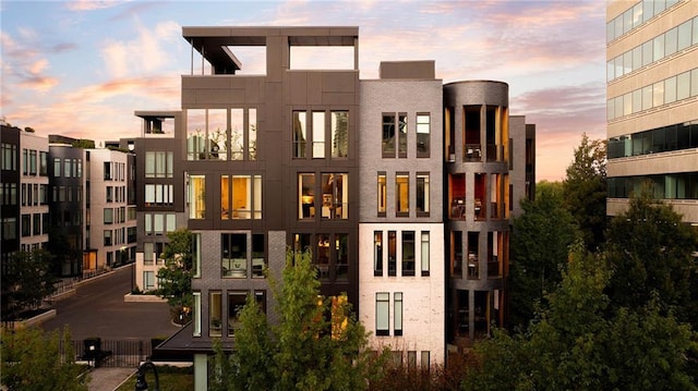 view of outdoor building at dusk