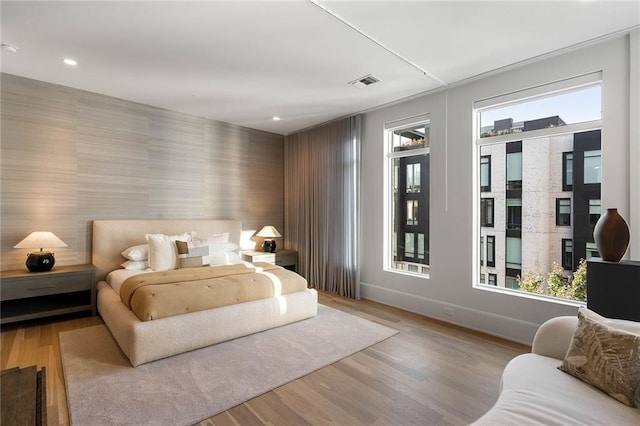 bedroom with light hardwood / wood-style flooring