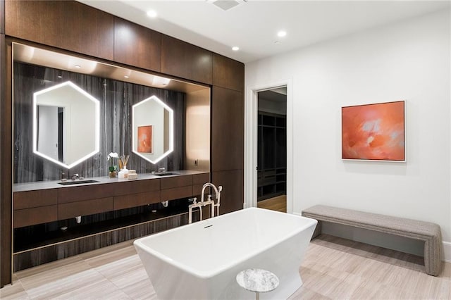 kitchen featuring dark brown cabinets and sink