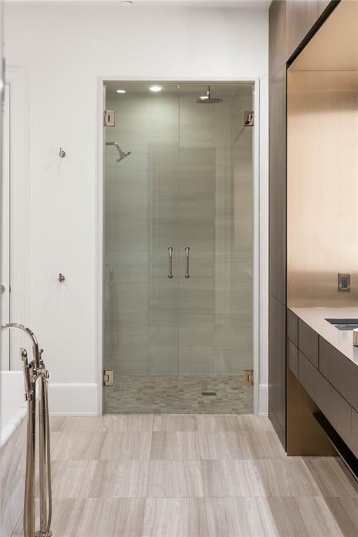 bathroom with vanity and an enclosed shower