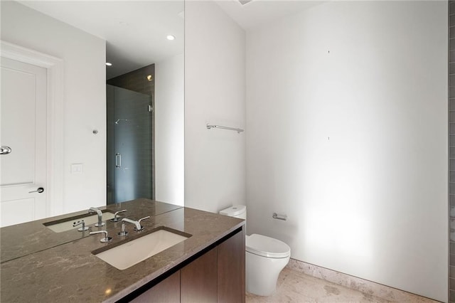 bathroom with vanity, toilet, and walk in shower