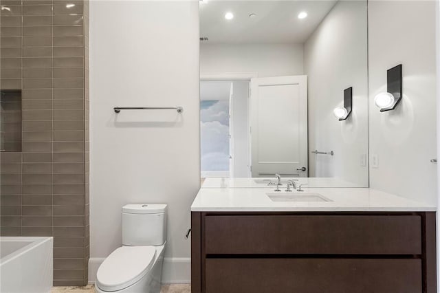 bathroom featuring vanity and toilet