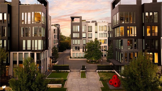 view of outdoor building at dusk