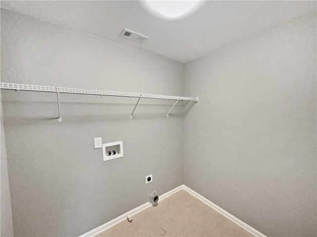 clothes washing area with hookup for a washing machine, visible vents, gas dryer hookup, electric dryer hookup, and laundry area