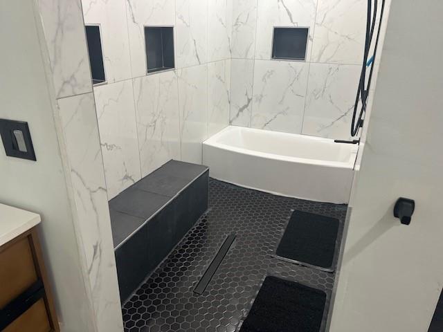 bathroom featuring tile patterned flooring and vanity