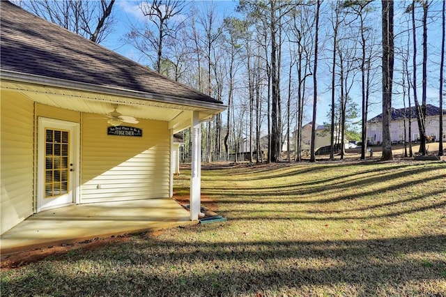 view of yard featuring a ceiling fan and a patio area