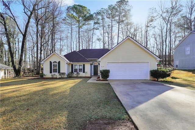 ranch-style house featuring a front yard, a garage, and driveway