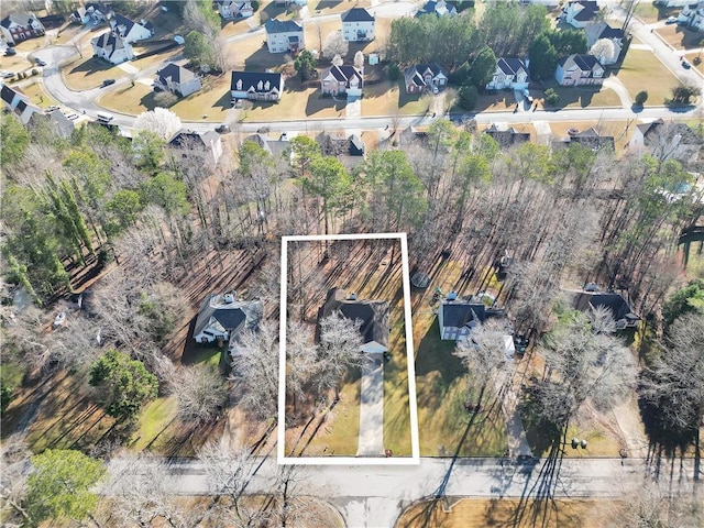 birds eye view of property with a residential view