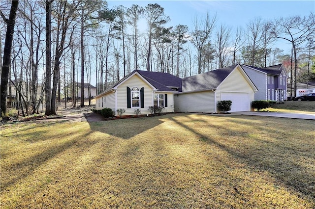 single story home with driveway, an attached garage, and a front yard