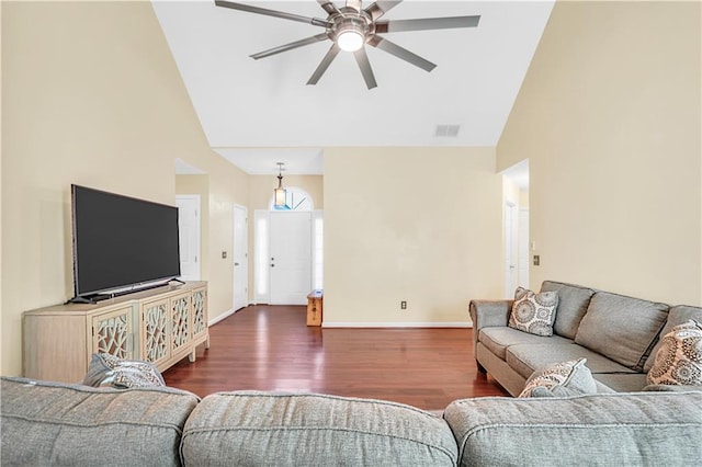 living room featuring visible vents, high vaulted ceiling, wood finished floors, baseboards, and ceiling fan