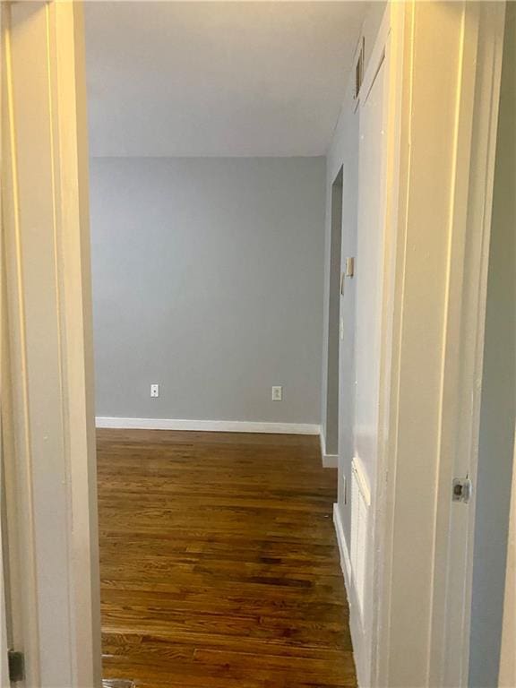 hallway featuring dark wood-type flooring