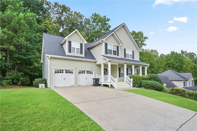 view of front of property with covered porch, a garage, and a front lawn