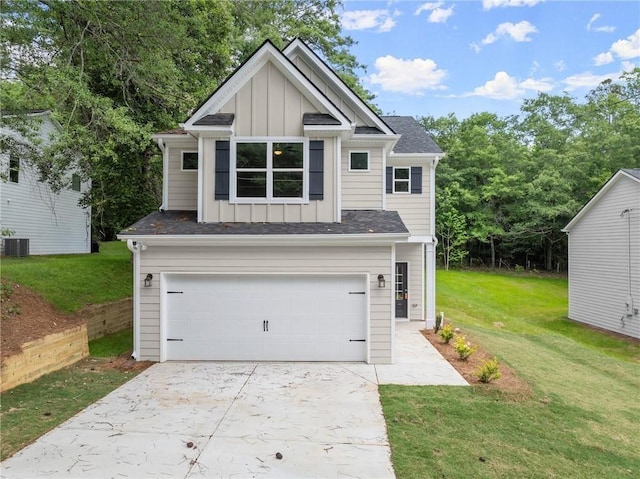 view of front of home featuring cooling unit, a garage, and a front lawn