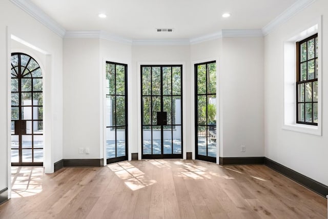 650 Moores Mill Rd NW Unit 1, Atlanta, GA 30327 - unfurnished room with plenty of natural light, wood finished floors, ornamental molding, and recessed lighting
