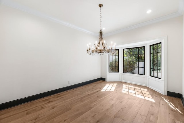 650 Moores Mill Rd NW Unit 1, Atlanta, GA 30327 - spare room featuring a chandelier, ornamental molding, wood finished floors, and recessed lighting