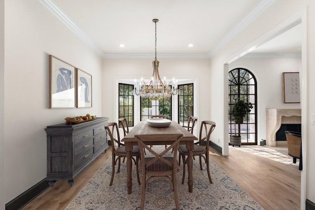 650 Moores Mill Rd NW Unit 1, Atlanta, GA 30327 - dining room featuring a chandelier, healthy amount of natural light, light wood-style floors, ornamental molding, and recessed lighting