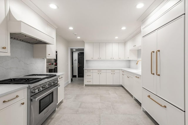 650 Moores Mill Rd NW Unit 1, Atlanta, GA 30327 - kitchen with stainless steel appliances, premium range hood, recessed lighting, backsplash, and white cabinets