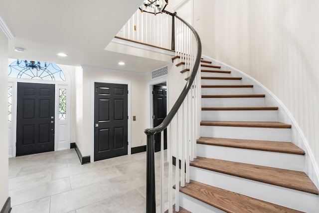 650 Moores Mill Rd NW Unit 1, Atlanta, GA 30327 - tiled foyer entrance featuring a chandelier, stairway, and recessed lighting
