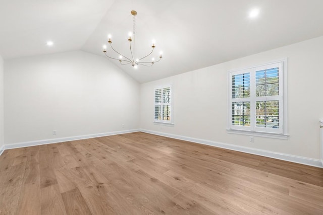 650 Moores Mill Rd NW Unit 1, Atlanta, GA 30327 - additional living space with a chandelier, healthy amount of natural light, lofted ceiling, and light wood-style floors