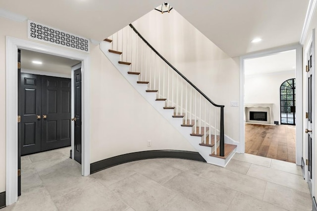 650 Moores Mill Rd NW Unit 1, Atlanta, GA 30327 - stairs featuring a fireplace and recessed lighting
