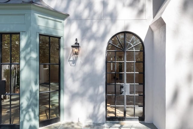 650 Moores Mill Rd NW Unit 1, Atlanta, GA 30327 - view of exterior entry featuring stucco siding and french doors