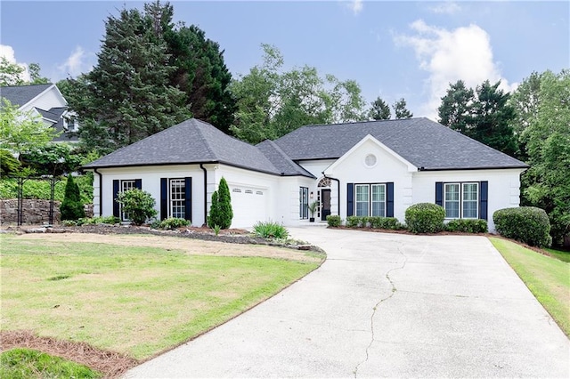 823 Laurel Crest Ct SW, Marietta, GA 30064 - view of front of house featuring a front lawn, driveway, a garage, and a shingled roof