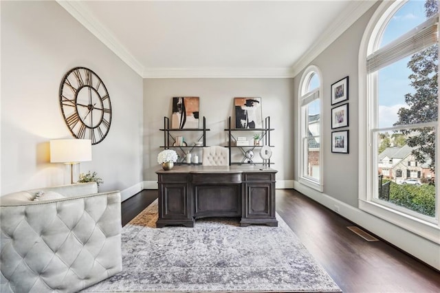 office with visible vents, baseboards, dark wood-style floors, and crown molding