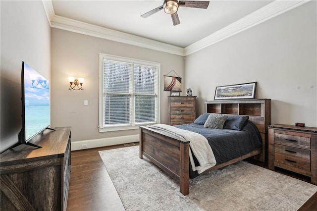 bedroom featuring a ceiling fan, crown molding, dark wood-style floors, and baseboards