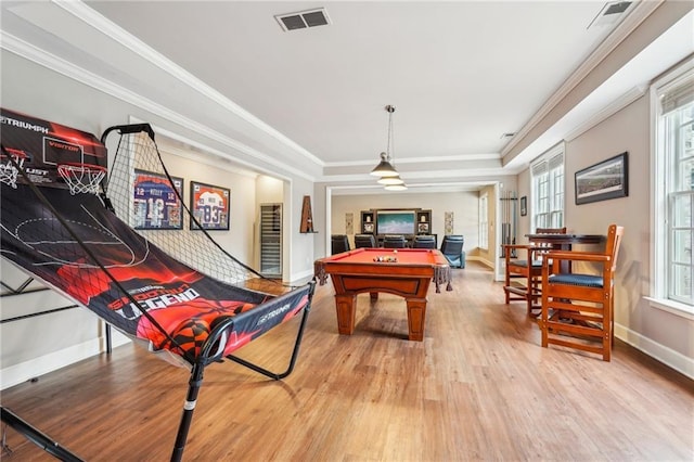 playroom featuring visible vents, ornamental molding, a tray ceiling, wood finished floors, and pool table